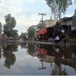 A view of stagnant water after heavy rainfall inundates city streets.