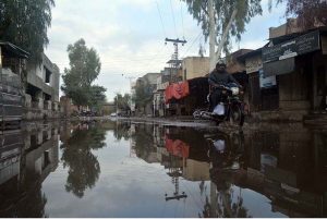 A view of stagnant water after heavy rainfall inundates city streets.