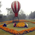 PHA workers install flower plants along Canal Road in the provincial capital as part of the city’s beautification drive.