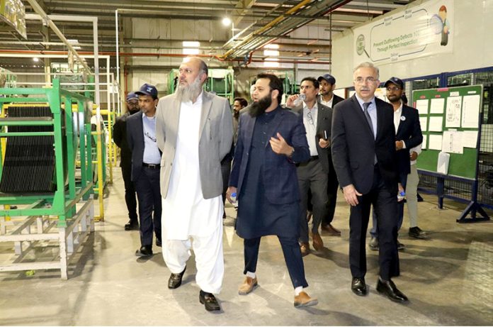 Federal Minister for Commerce Jam Kamal Khan inspects production facilities during his visit to the PAAPAM Bin Qasim automotive cluster, where he toured key industrial units and expressed optimism about strong growth, indigenization, and export potential of Pakistan's local automobile industry
