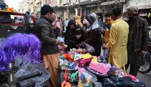 Family busy purchasing children’s toys at Landa Bazaar