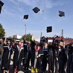 Successful students throw their caps in celebration during the 29th Academic Convocation and Career Fair 2026 ceremony at Mehran University of Engineering & Technology
