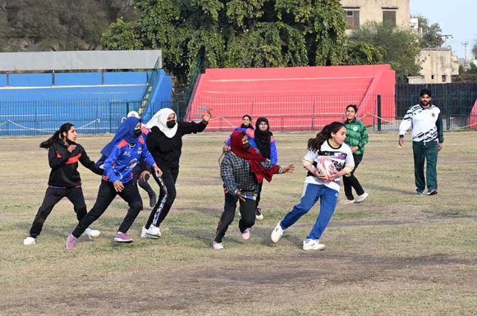 Players give rugby trials during the “Khelta Punjab Pink Games Trials” held at a Sports Stadium, organized by the Sports Department