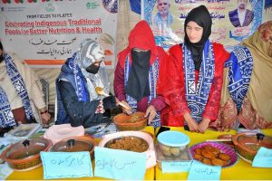 Women visits and observe traditional Saraiki dishes displayed on food stall during Saraiki Culture Day celebrations at the Tea House.