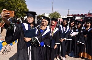 Successful students throw their caps in celebration during the 29th Academic Convocation and Career Fair 2026 ceremony at Mehran University of Engineering & Technology