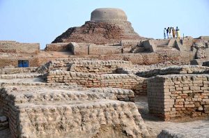 Labourers are busy repairing work of the walls in front of Stupa at world famous archeological site of Mohen jo-Daro (Mound of Dead).