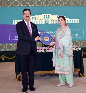 A participant of the National Workshop Balochistan presenting a souvenir to Chairman Senate Syed Yousuf Raza Gilani at Aiwan-e-Sadr. APP/MAF/FHA