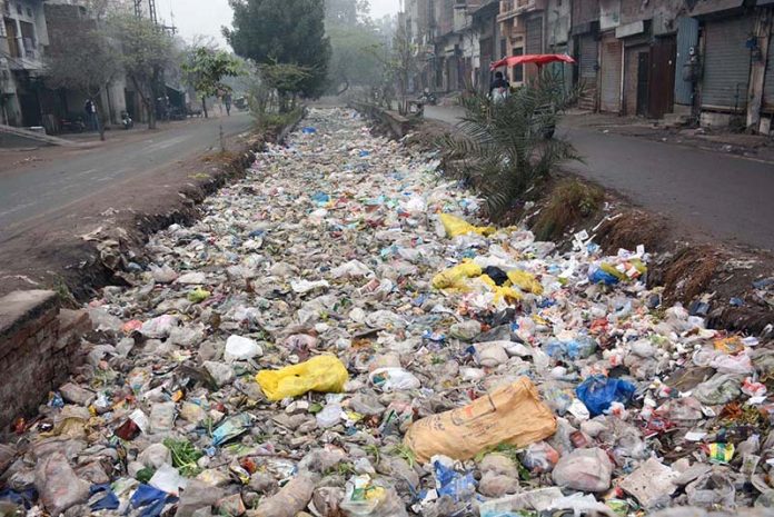 A view of nullah filled with garbage at New Green Town area near Millat Road creating environmental problems and needs the attention of concerned authorities