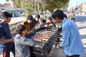 Children play football at Mightymast Leisure in Fazil Town to pass their time.