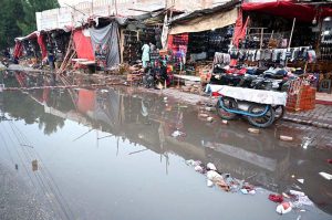 A view of stagnant rain water accumulated on Girls College Road after rain in the city.