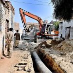 Labourers are busy laying new sewerage line from Latifabad to the Indus River