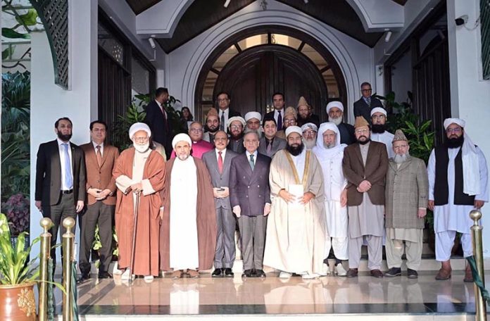 Prime Minister Muhammad Shehbaz Sharif in a group photo with members of the National Paigham e Aman Committee