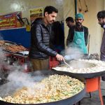 A vendor prepare to serves traditional food from his roadside setup at the busy streets offering a taste of local flavours in the provincial city .