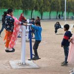 Children enjoying swings at Sukh Chayn Park in Federal Capital