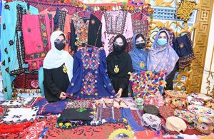 Students display handmade traditional outfits during the Regional Level STEAM Competition organized by the Directorate of Primary Schools Education at Sachal Banquet.