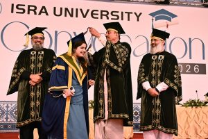 Sindh Minister for Universities & Boards Muhammad Ismail Rahoo awards a gold medal to a successful student during the 23rd convocation 2026 at Isra University