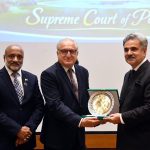 The Hon'ble Chief Justice of Pakistan, Mr. Justice Yahya Afridi, being presented with a souvenir by Mr. Farhan Aziz Khawaja, Director General, Civil Service Academy, who led the delegation of the 53rd Common Training Program, at the Supreme Court of Pakistan.