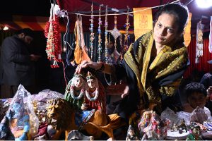 Girls looking at a Murti during 5th Collective Marriage Program organized by MSL Foundation at Railway Ground