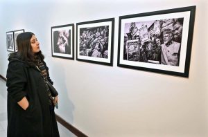 A visitor keenly viewing photography during a closing ceremony of photography exhibition and book launch titled "KASHMIR, WAIT & SEE" by Shah Zaman Baloch internationally renowned photographer Cédric Gerbehaye at PNCA.