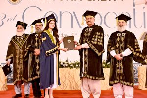Sindh Minister for Universities & Boards Muhammad Ismail Rahoo awards a gold medal to a successful student during the 23rd convocation 2026 at Isra University