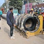 Workers are busy preparing pipes to be laid to turn wires underground on Saidpur Road
