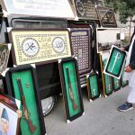 A vendor displays antique decorative items for sale to attract customers along the Northern Bypass.