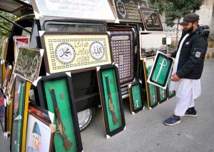 A vendor displays antique decorative items for sale to attract customers along the Northern Bypass.