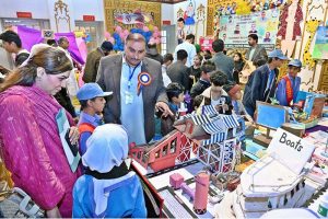 Students display handmade traditional outfits during the Regional Level STEAM Competition organized by the Directorate of Primary Schools Education at Sachal Banquet.