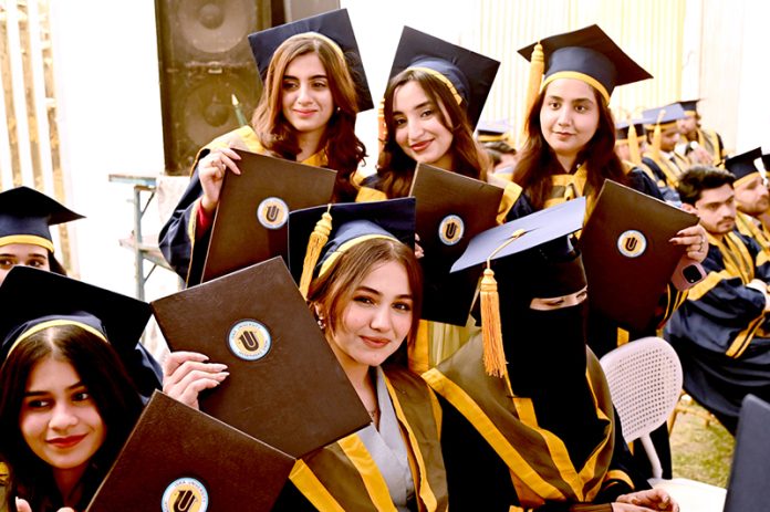 Successful students display their degrees during the 23rd convocation 2026 at Isra University