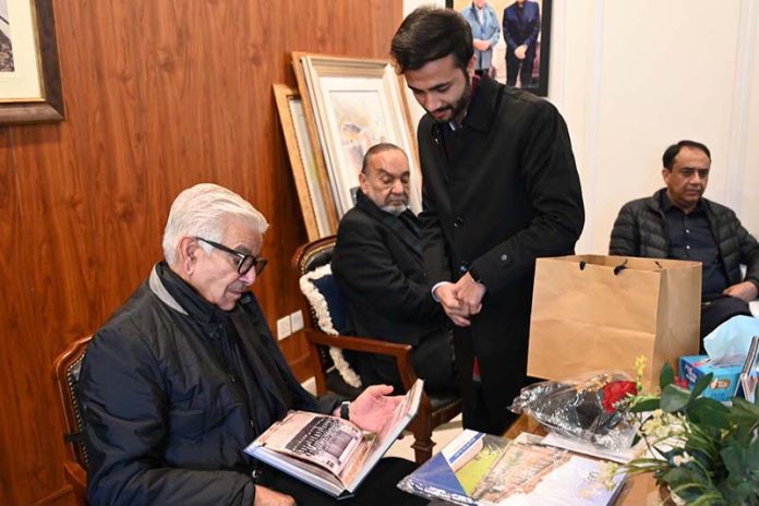 Defense Minister Khawaja Muhammad Asif reads the annual magazine of Cadet College Hassan Abdal, reminiscing about his days spent there