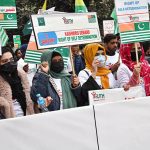 A large number of people participate in a walk expressing solidarity with Kashmiris on Right to Self-Determination Day in front of the Lahore Press Club