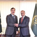 Acting President Syed Yousuf Raza Gilani Shaking hands with newly elected Senator Abid Sher Ali at the Parliament House in the federal capital
