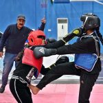 Players compete in wushu trials during the “Khelta Punjab Pind Games Trials” held at a sports gymnasium, organized by the Sports Department.