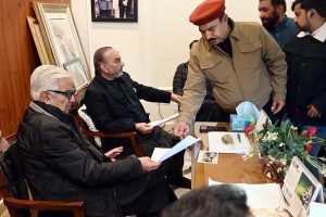 Defense Minister Khawaja Muhammad Asif reads the annual magazine of Cadet College Hassan Abdal, reminiscing about his days spent there