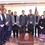 Acting President Syed Yousuf Raza Gilani in a group photo with delegation of businessmen, traders, investors and industrialists at the Parliament House in the federal capital