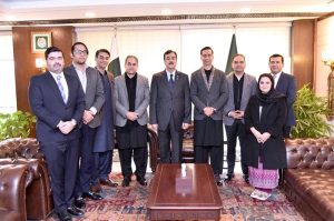 Acting President Syed Yousuf Raza Gilani in a group photo with delegation of businessmen, traders, investors and industrialists at the Parliament House in the federal capital