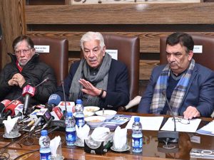 Defense Minister Khawaja Muhammad Asif addresses the business community at the Sialkot Chamber of Commerce & Industry (SCCI), with President SCCI Syed Ehtsham Mazhar Gilani, MPA Faisal Ikraam Ch, Sheikh Riaz ul Din, and Dr. Noman Adress Butt attending the session.