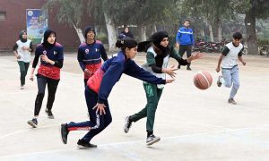 Basketball players attempt to score during the final of the inter-collegiate tournament at Government Group College, Chandni Chowk, where Reader College defeated Superior College to claim victory