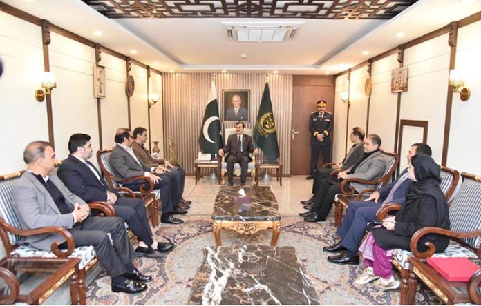 Acting President Syed Yousuf Raza Gilani meeting with a delegation of businessmen, traders, investors and industrialists at the Parliament House in the federal capital