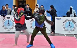 Players compete in wushu trials during the “Khelta Punjab Pind Games Trials” held at a sports gymnasium, organized by the Sports Department.