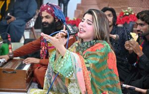 Sufi singers Wahid Bukhsh and Sain Sajid Ali perform at a function held at the Press Club.