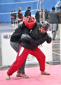 Players compete in wushu trials during the “Khelta Punjab Pind Games Trials” held at a sports gymnasium, organized by the Sports Department.
