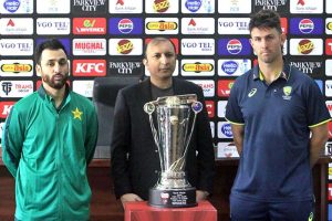 Pakistan's T20 team captain Salman Ali Agha, and his Australian counterpart Mitchell Marsh pose for photograph with T20 Series Trophy at Gaddafi Stadium.