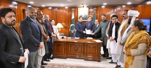 Speaker National Assembly Sardar Ayaz Sadiq hands over the official notification of the appointment of the Leader of the Opposition in the National Assembly to a delegation of opposition members at Parliament House in the federal capital