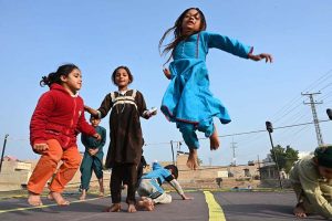 Children enjoy jumping on Trampoline near Bakapur Village Road.
