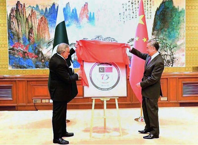 Deputy Prime Minister and Foreign Minister Senator Mohammad Ishaq Dar and Chinese Foreign Minister Wang Yi, jointly unveiled the logo for the 75th anniversary of Pakistan-China diplomatic relations