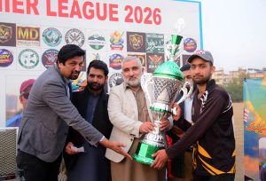 Dhirkot Premier League 2026 winning team captain Rehan Mehtab receiving the trophy from the Sardar Imran Aziz President Business Forum