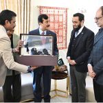 Chairman Senate Syed Yousaf Raza Gillani presents Souvenir to Mr. Attaullah Tarar, Federal Minister for Information and Broadcasting in federal capital.