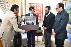Chairman Senate Syed Yousaf Raza Gillani presents Souvenir to Mr. Attaullah Tarar, Federal Minister for Information and Broadcasting in federal capital.