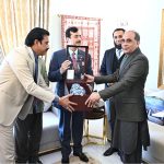 Chairman Senate Syed Yousaf Raza Gillani presents Souvenir to Mubashir Hassan Executive Director General /PIO in federal capital.